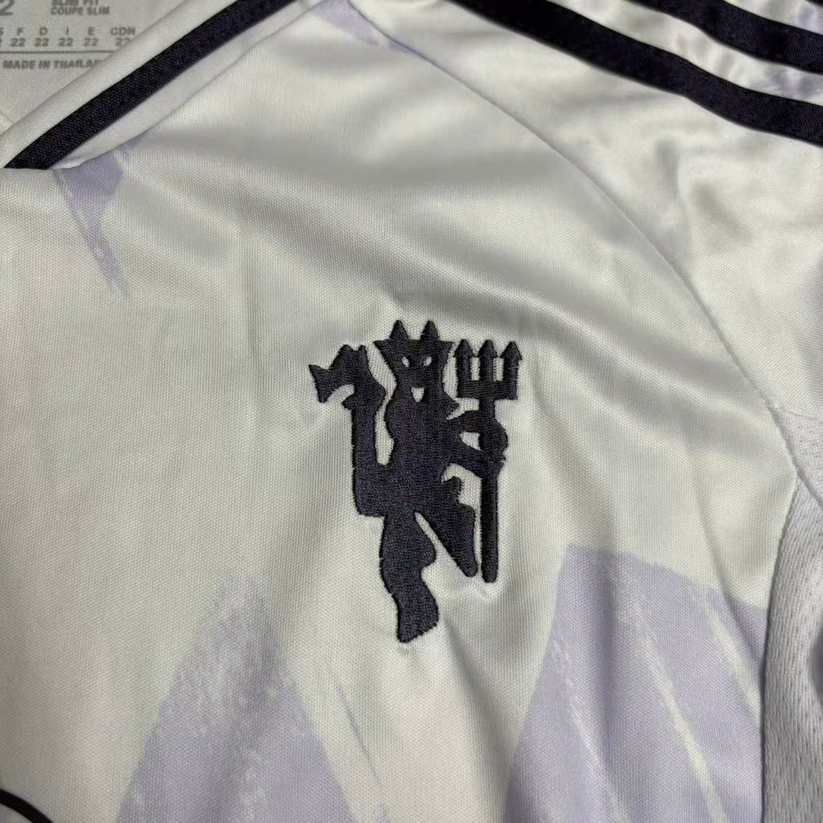 Kit infantil Manchester United Away 25/26 - Branca